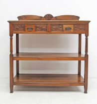 An Art Deco carved walnut dresser