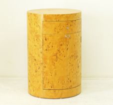 A cylindrical burl maple wood drum bar