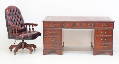 A flame mahogany twin pedestal desk