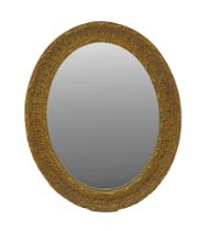 A carved giltwood oval mirror