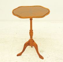 A satinwood pedestal table