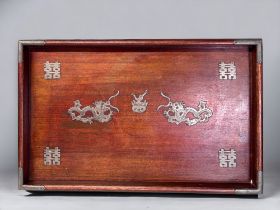 A CHINESE WOODEN METAL MOUNTED SERVING TRAY. Early 20th century. Mounted metal Dragons with xixi '