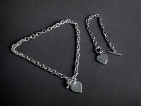 A STERLING SILVER 'HEART' FOB NECKLACE, TOGETHER WITH A SIMILAR BRACELET. Gross weight - 63g