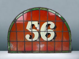 A LARGE VICTORIAN STAINED GLASS FANLIGHT HOUSE NUMBER TRANSOM. Green stained glass border with