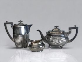 19TH CENTURY ATKIN BROTHERS SILVER PLATE TEAPOT & MILK JUG. Together with a similar Britannia