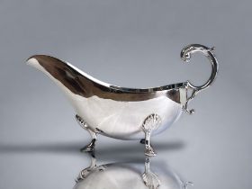 A MAPPIN & WEBB SILVER PLATE GRAVY BOAT. Shell design feet. Marks to base. 9.5 x 19cm