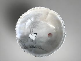 A JAPANESE KUTANI PORCELAIN BOWL. Monochrome painted background with enamel painted Cranes and