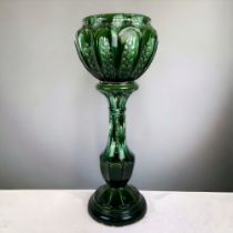 A LARGE WILLIAM AULT JARDINIERE & STAND. Green glazed majolica. AF - REPAIRS & DAMAGES.