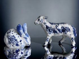 TWO DELFT BLUE & WHITE PAINTED FIGURINES. Depicting a Sheep & Rabbit. Both signed to base. Sheep -