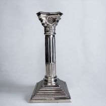 A STERLING SILVER CORINTHIAN CAPITOL COLUMN CANDLESTICK. Birmingham, 1965 hallmarks. Height - 19.5cm