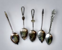A COLLECTION OF WHITE METAL BURMESE SPOONS. Length - 9.5cm