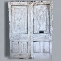A PAIR OF LARGE GEORGIAN DOUBLE EXTERNAL DOORS. Painted, with letterbox.