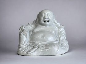 A CHINESE PORCELAIN SEATED BUDDHA. Qing dynasty. AF