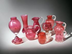 A COLLECTION OF TEN RUBY & CRANBERRY GLASS VASES & JUGS.