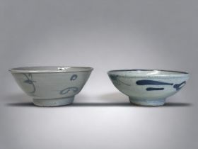 TWO CHINESE MINYAO 'KITCHEN QING' PORCELAIN BOWLS. Qing dynasty. Blue & white foliate designs.