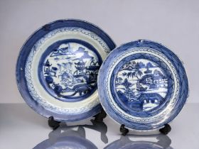 TWO 19TH CENTURY CHINESE PORCELAIN BLUE & WHITE PLATES. Qing dynasty. Painted seaside fishing