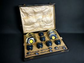 A cased set of Royal Worcester demitasse cups & saucers. Blue & gilt foliate design. Together with