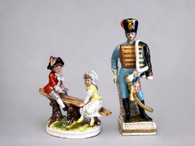 A Hand Painted Dresden Porcelain 'Hussar' Figure. Together with another figure group depicting