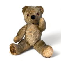 A vintage English wool plush teddy bear. 1950's? With swivel head & limbs. Length - 42cm