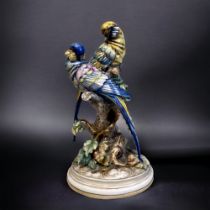 A Bruno Merli Porcelain 'Parrot' Figure Group. Capodimonte, made in Italy. Hand painted. Height -