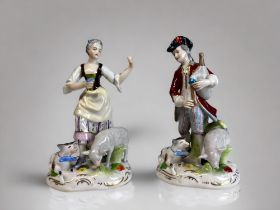 A Pair of Dresden Porcelain Figurines. Depicting a Shepherd & Shepherdess. Marked to base.