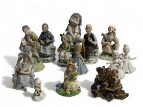 A mixed job lot of ceramic figurines.