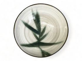 A large handcrafted Kasuga Showa centrepiece bowl. Spiral design ground with painted Bamboo