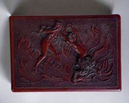 A 1930's decorative Bakelite box. The lid depicting a nude nymph & Satyr amongst flames. Stamped UDA
