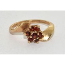 9ct gold Garnet flower head twist design ring size M