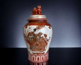 A Japanese Kutani porcelain vase. Meiji period. Baluster form with hand painted scenes with gilt