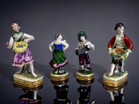 Two Pairs of German Volkstedt Porcelain Figurines. Includes a pair of hand painted 'musician'