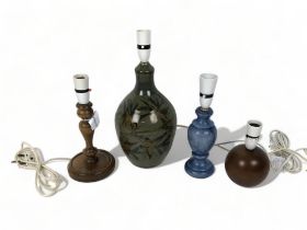 Four vintage table lamps. Including studio pottery and wooden examples.
