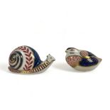 Two Royal Crown Derby paperweights. Including a snail & partridge.