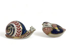 Two Royal Crown Derby paperweights. Including a snail & partridge.