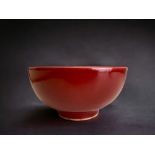 A Chinese red glazed porcelain bowl. Ming dynasty. Six character Jiajing marks. Property of an