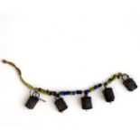 ANTIQUE TIBETAN / INDIAN BEADED COW BELLS. Strung with metal bells and multicoloured beads.