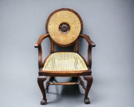An Edwardian Bergère Roundel backed bedroom Chair. Having ball and claw feet. In the 'Adam' style.