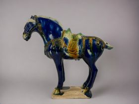 A Chinese 'Tang' style horse. Polychrome drip glaze. Marked to base. Height - 22cm