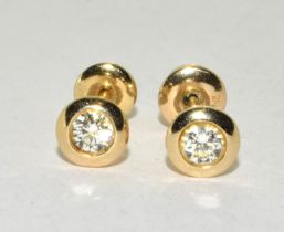 14ct gold Diamond stud earrings in an enclosed setting total diamond value approx 40pionts