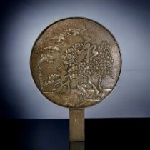 A JAPANESE BRONZE HAND MIRROR. Depicting Cranes & cherry tree scene. Signed to lower left.