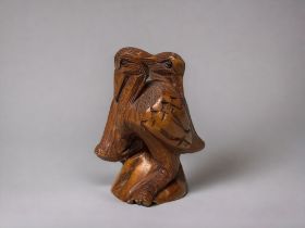 A Japanese carved Netsuke. 20th century. Depicting a pair of Pelicans. Signed to base.