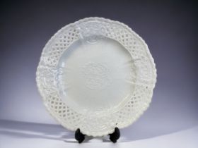 A 19th century Meissen porcelain plate. White glazed, with moulded 'Rose' blossoms, with weave