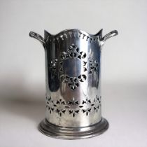A VICTORIAN SILVER PLATE WINE BOTTLE HOLDER. Reticulated stylised design. Marked to base. Height -