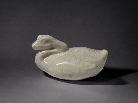 A CHINESE PORCELAIN ZOOMORPHIC WATER DROPPER. Crackle ground, Modelled as a Goose on the water. 5