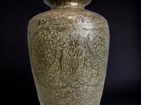 AN INDIAN CHISELLED BRASS VASE. HEIGHT - 30CM
