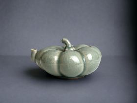 A Chinese celadon porcelain water dropper. Formed as a Pumpkin. Marks to base. 5 x 9 cm