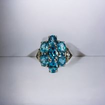 A large 6.42ct Swiss blue Topaz ladies ring. Set in sterling silver. Ltd edition. With certificate