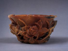 A FINELY CARVED CHINESE SOAPSTONE BRUSH WASHER. Qing dynasty. Intricately carved 'Lotus' design.