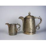 A VICTORIAN SILVER PLATE KASHMIRI STYLE TEAPOT & MILK JUG. By Roberts & Belk. Elaborately