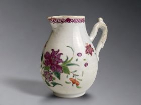 A Chinese Famille Rose export porcelain sparrow beak jug. Qianlong period. Painted enamels foliate